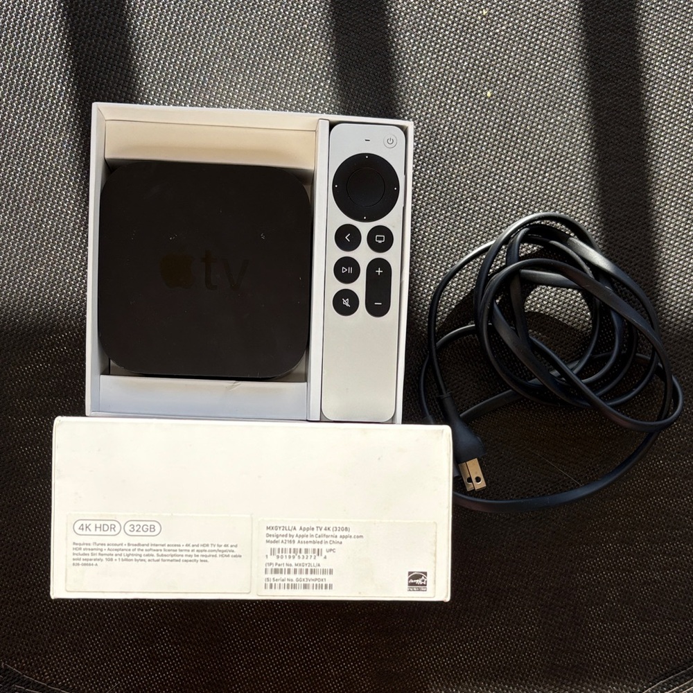 Apple TV 4K with Silver Siri Remote and Black Unit